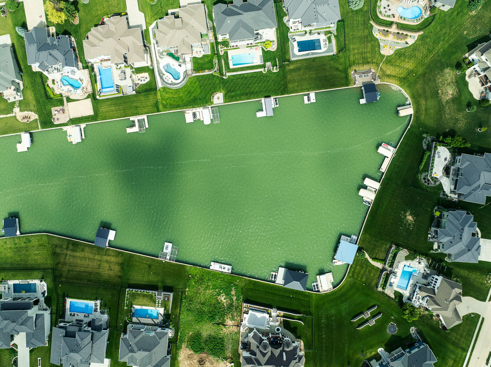 aerial plan view lake community docks home residential neighborhood