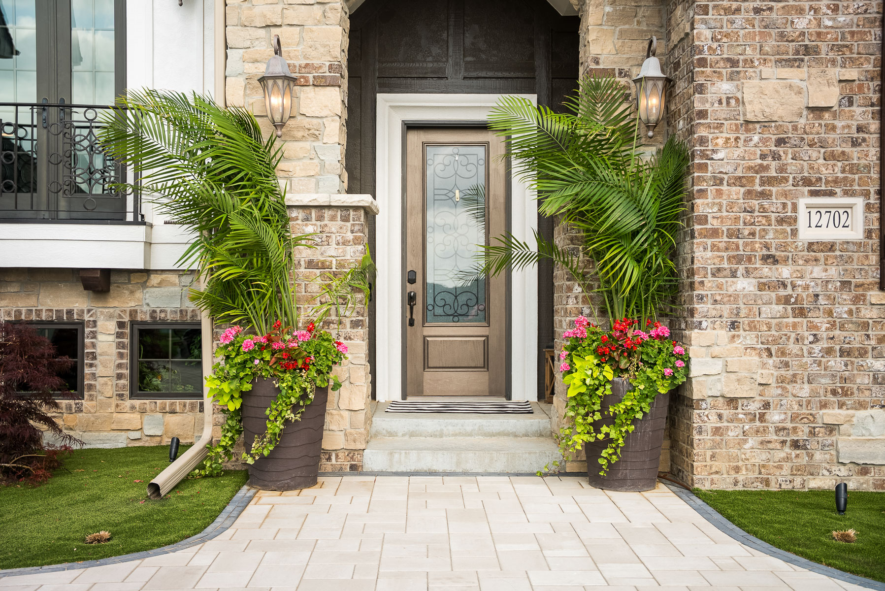 potted plants and flowers outside home front door