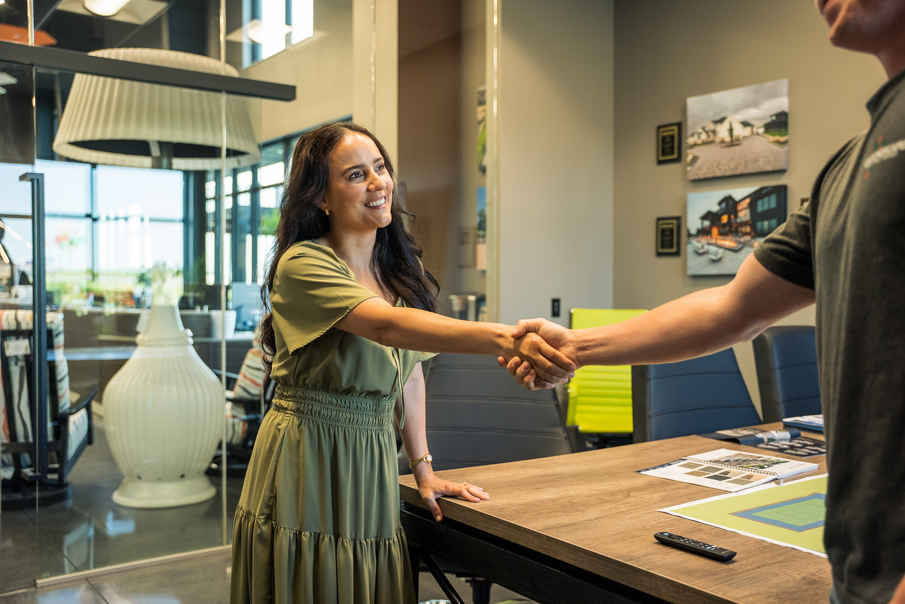 landscape designer client consultation meeting hand shake happy