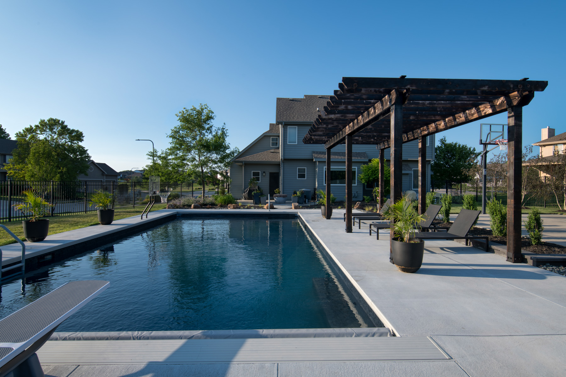 pool pergola seating concrete deck diving board hoop